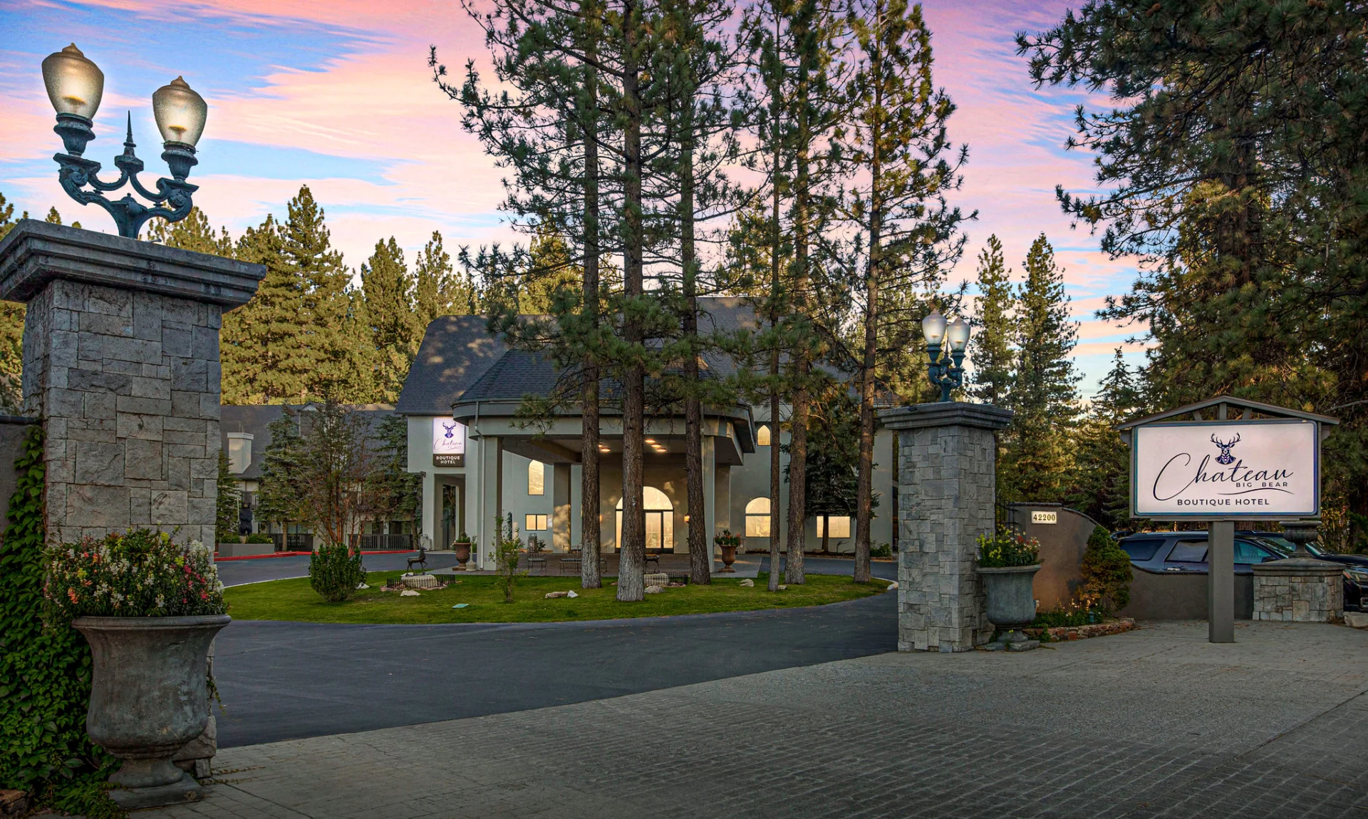 front entrance gate and sign at sunset